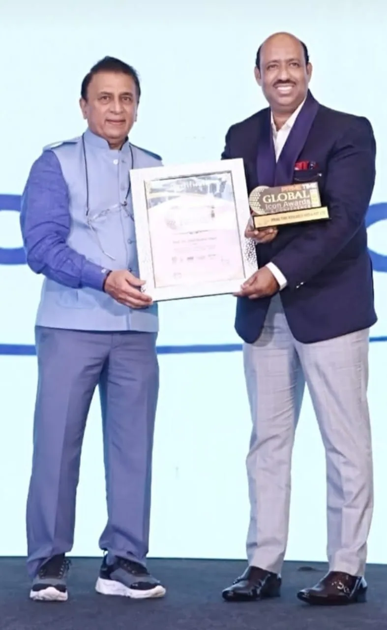 Dr. Sunil Kumar Singh receiving education award and certificate